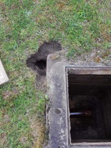 drain defect outside with hole exposed